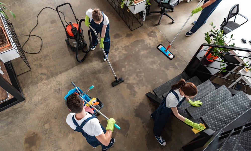 top view of cleaning company team cleaning modern office